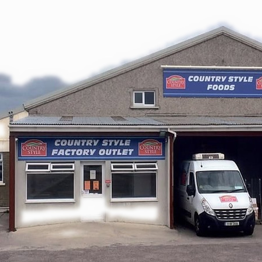 The Country Style Factory Outlet building in Grannagh with a delivery van outside