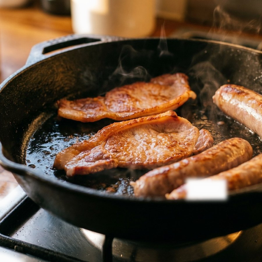 A full Irish breakfast frying in a pan
